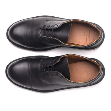 chaussures manager vue de dessus noir cuisine salle restauration