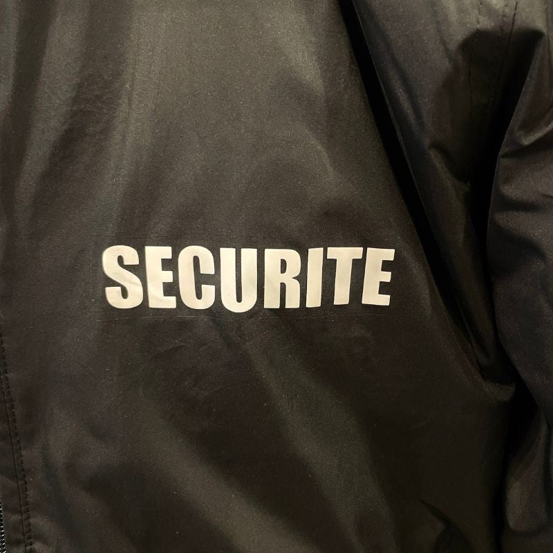 logo sécurité sur bomber noir