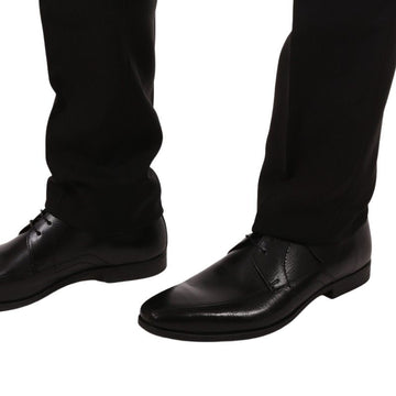 Pantalon noir taille au niveau des chevilles