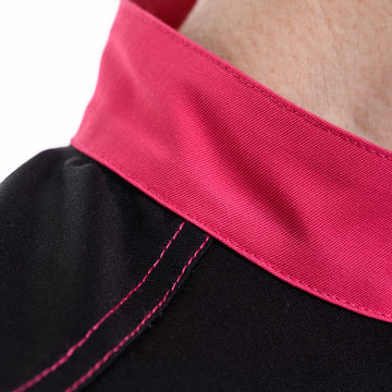Détail du col et des surpiqures rose sur la veste de cuisine femme elbax Robur