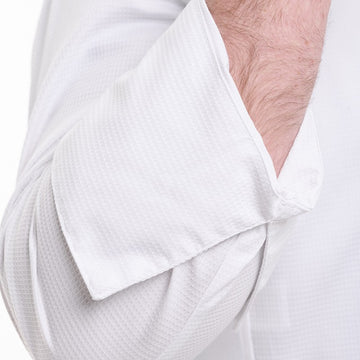 Détail des manches longue retroussable sur la veste de cuisine Frénésie de la marque Lafont
