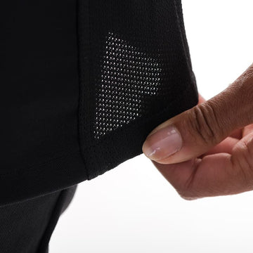détail veste de cuisine femme noir